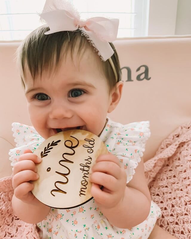 n i n e  m o n t h s ✨ our sweet gemma babe is getting so big! her two top teeth just cut through 🦷 she&rsquo;s army crawling all over the place but would much rather practice standing up. she still loves saying dada all day long. she knows clap you