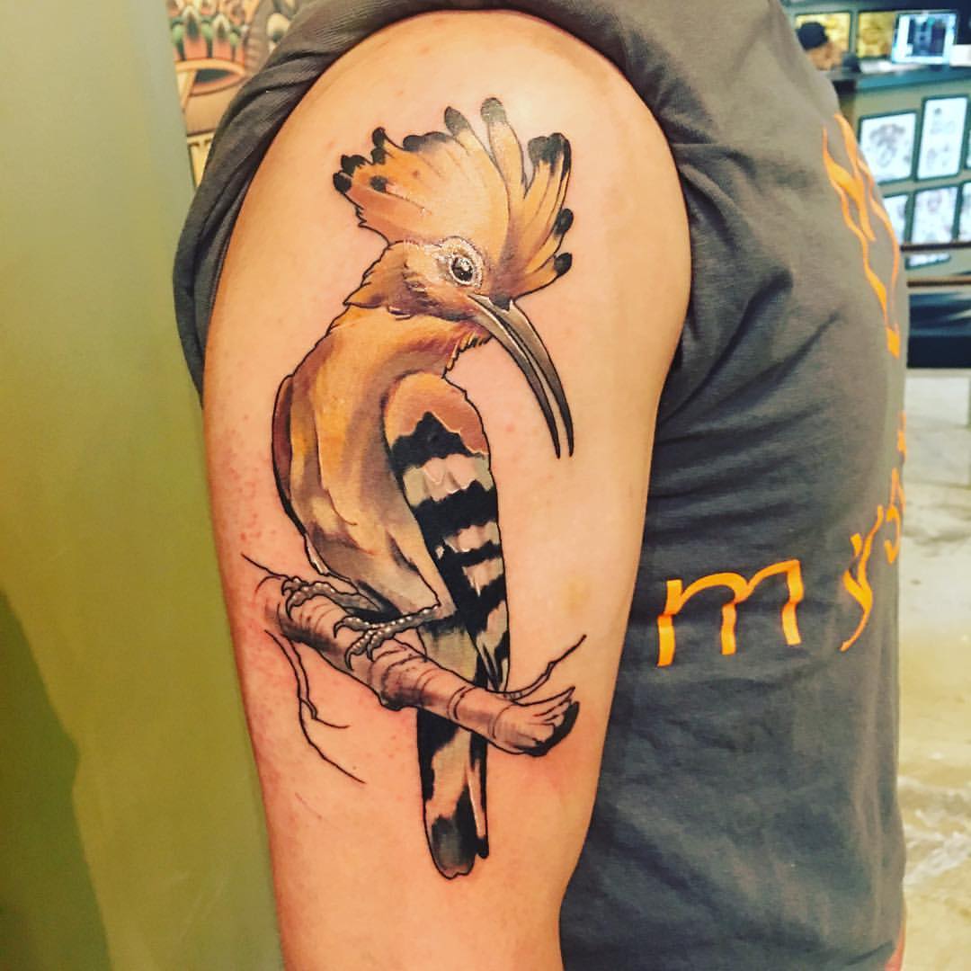 Rostam's tattoo, described below.