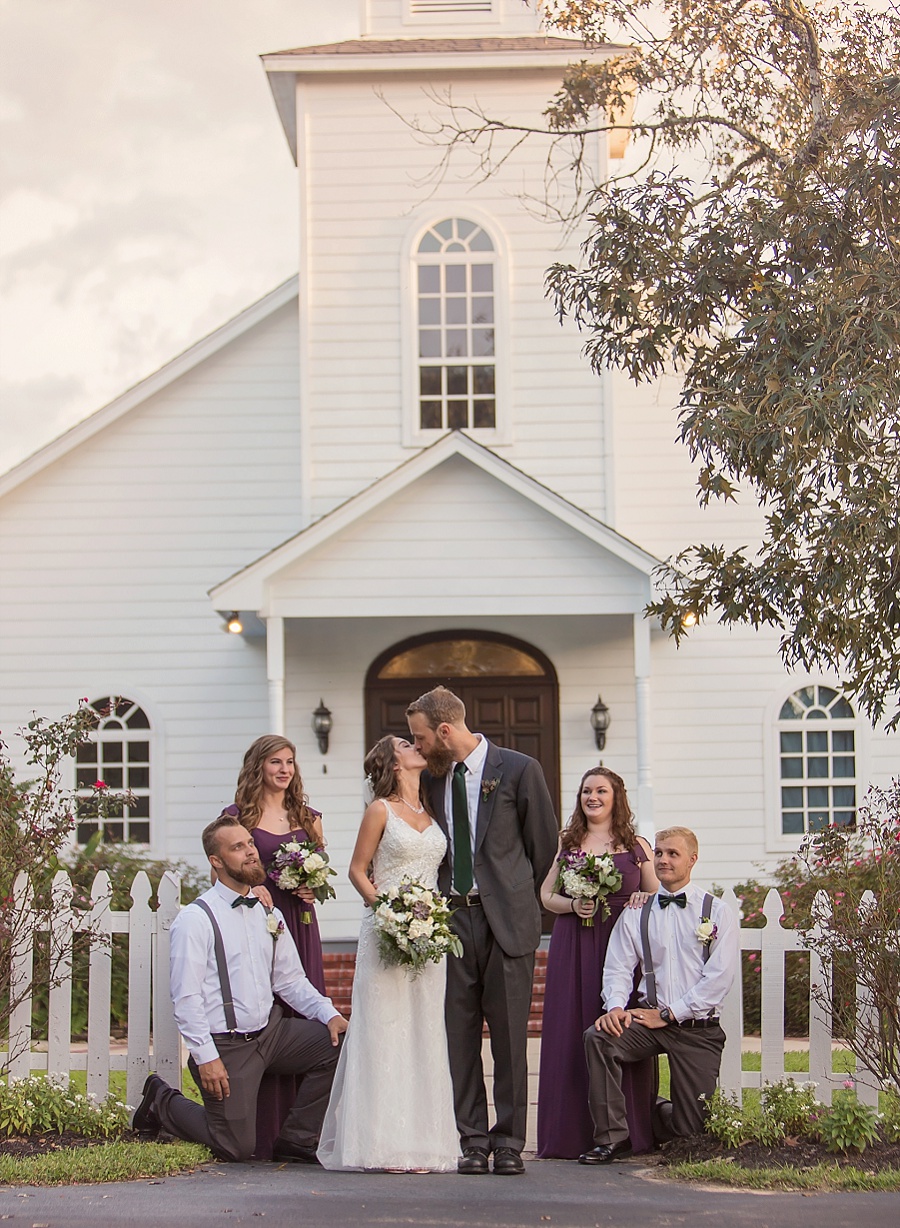 bridal-party-kiss-chapel-ashelynn-manor-plum-emerald-color-scheme-fine-art-photography-wedding-images.jpg