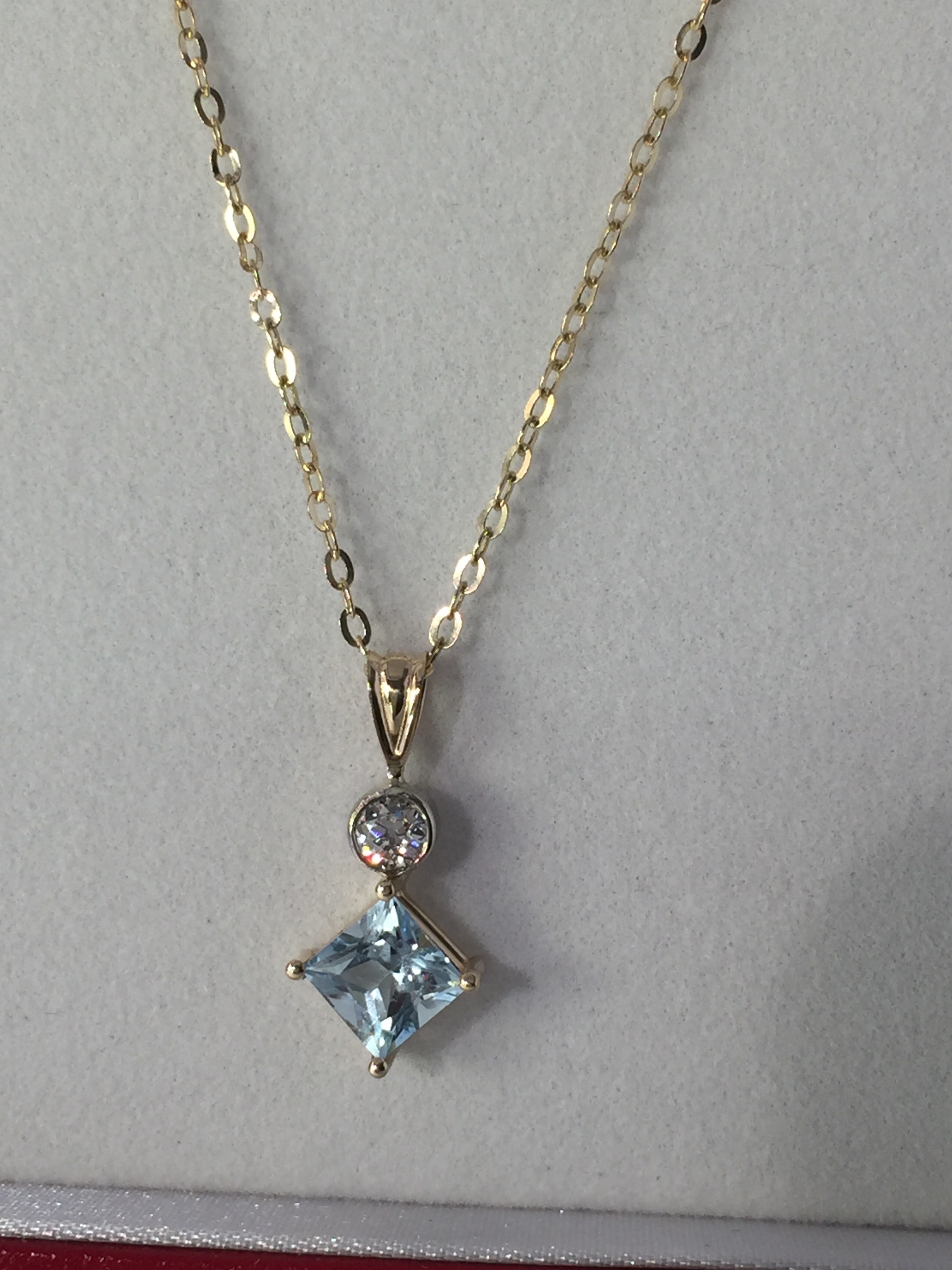 Aquarmarine and diamond pendant