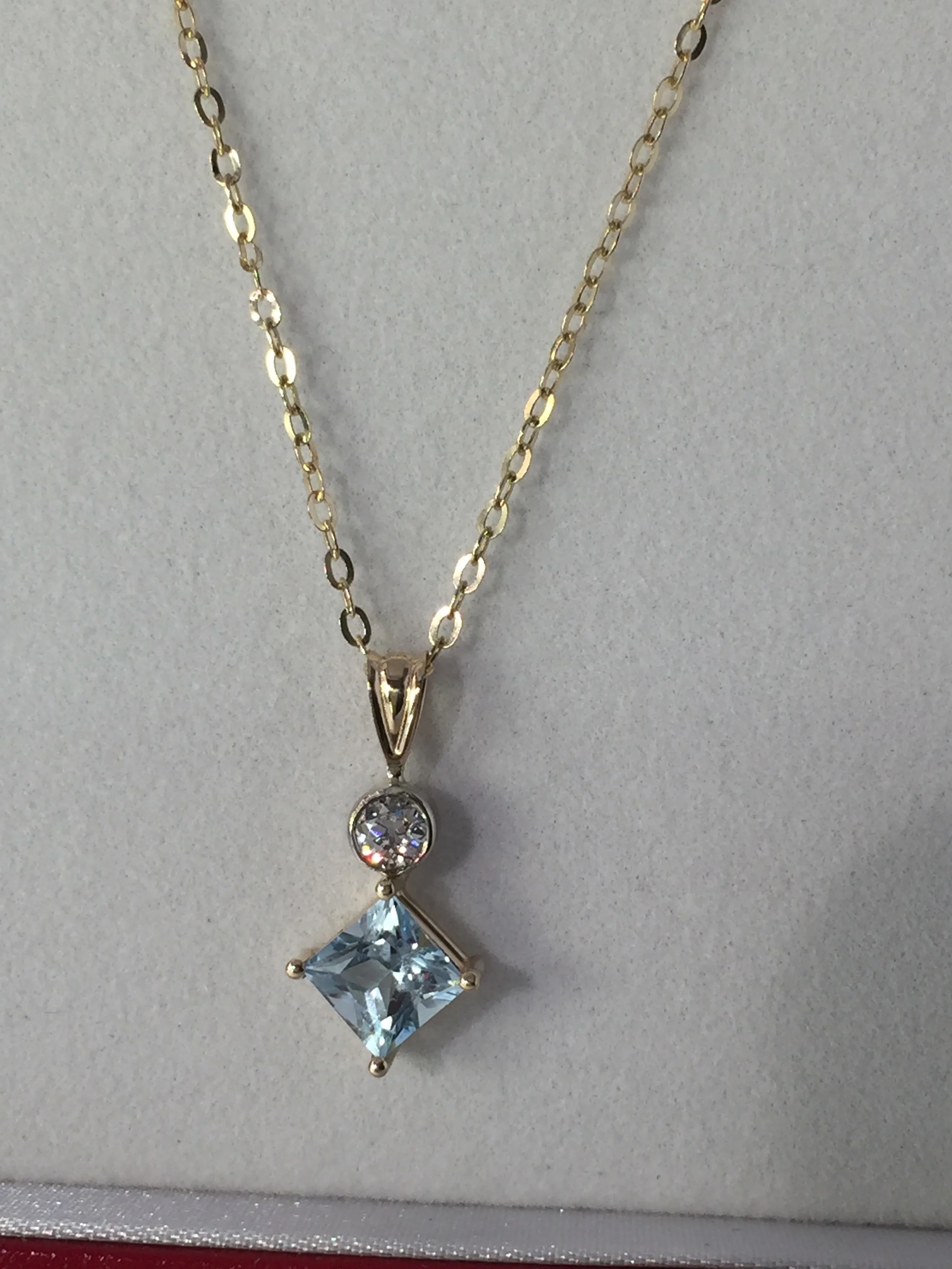 Aquarmarine and diamond pendant