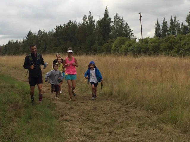 Exhausted at the end of my half marathon, when the tribe came to run me in.