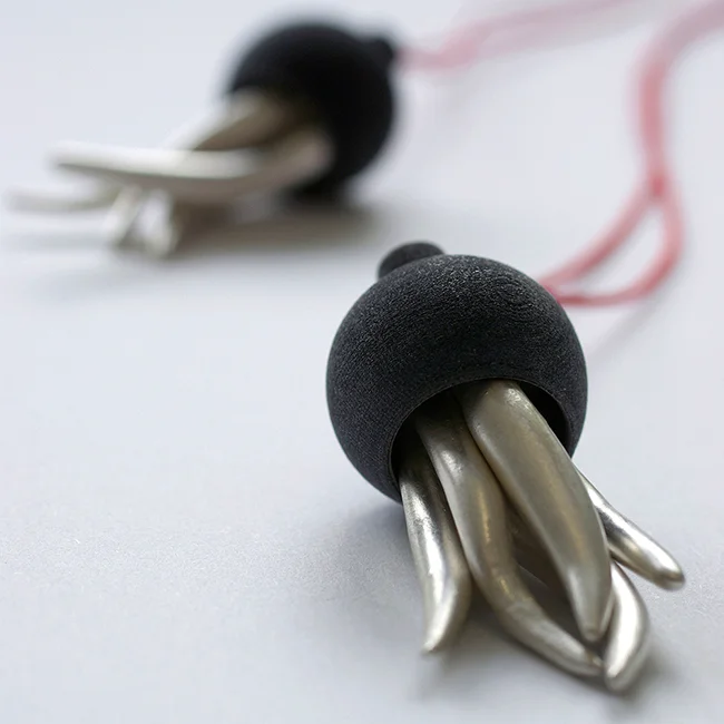 Unbecoming , 2014 pendant 925 silver, plastic, waxed cord