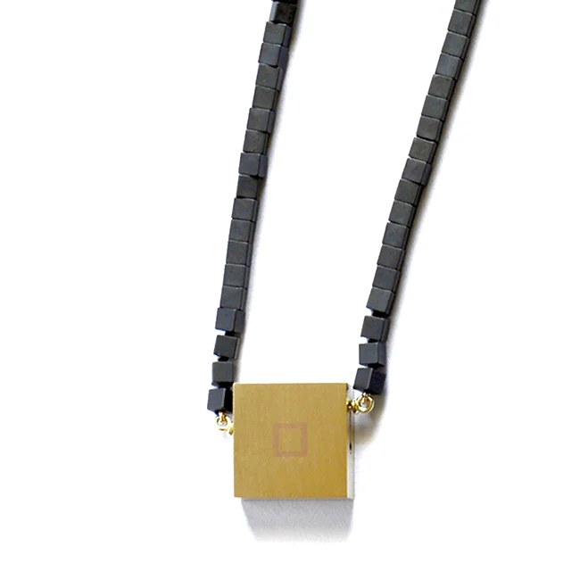 Box , 2018 pendant 18k yellow gold, shakudo, hematite beads