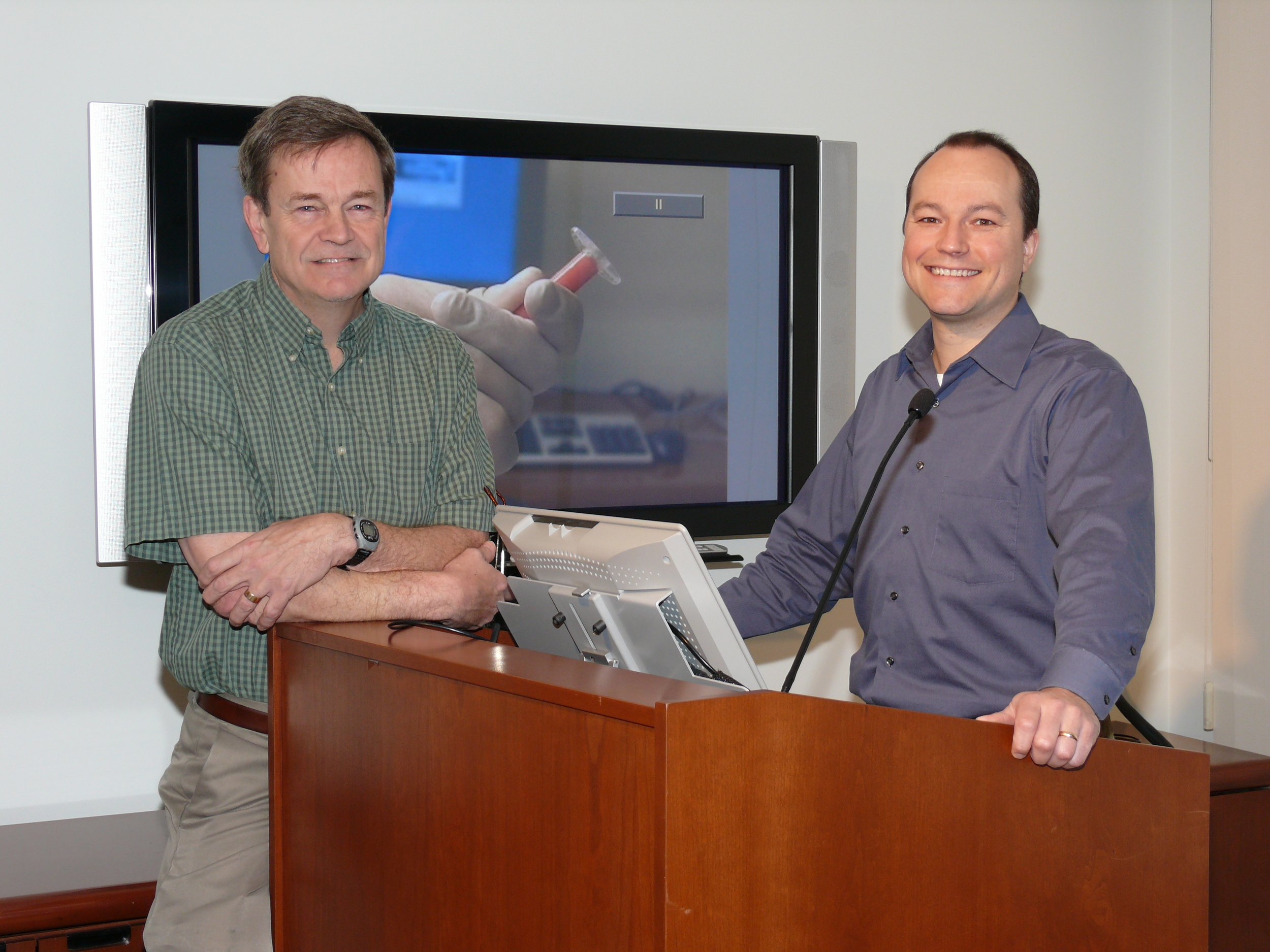 Drs. Jim Kobler and James Heaton prepare to give a lecture in the Voice Center Conference Room.