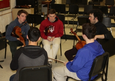 Eric discusses an upcoming TV appearance with members of the Greater Bridgeport Youth Orchestras' Principal Orchestra.
