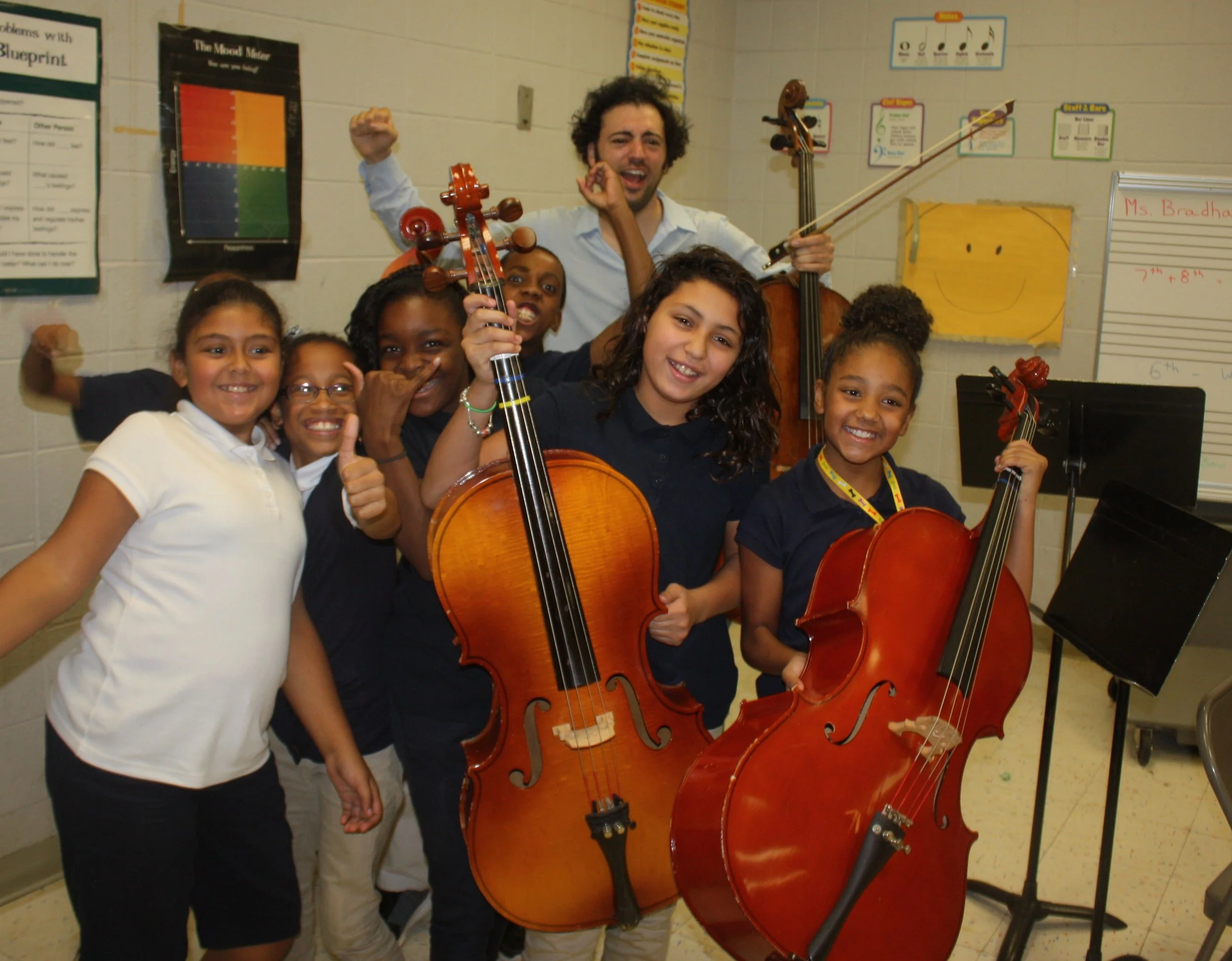 Eric makes new friends at High Horizon Magnet School in Bridgeport after a musical presentation.