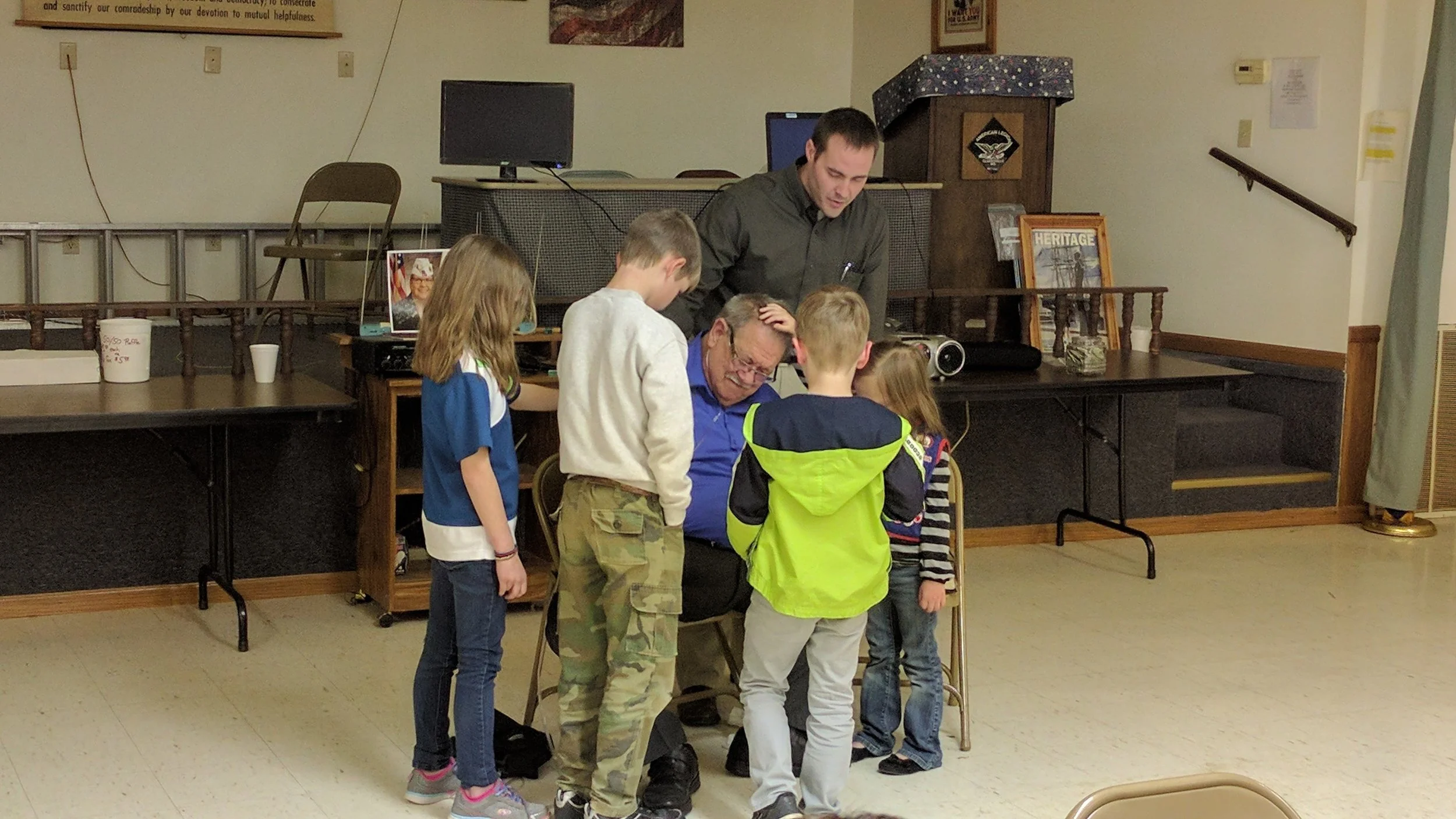 Pastor Jason & some of our AWANA group praying for Pastor Dean and Shining Light.