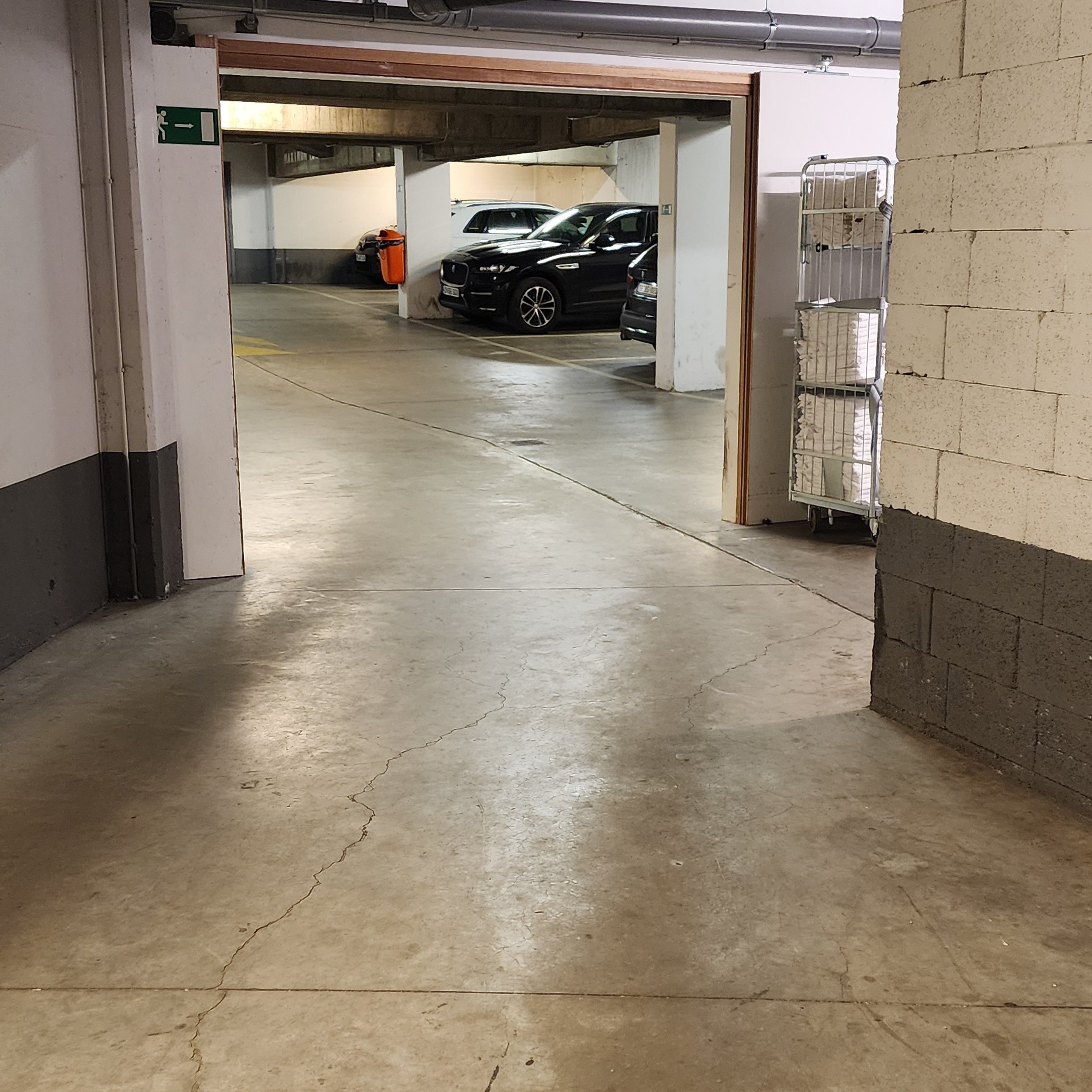 Closer look at the narrow opening to the parking area.