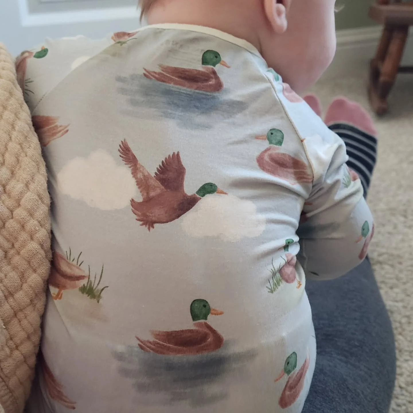 I pulled this outfit out of the drawer for my doula baby this morning, and I have not stopped cracking up! And I'm not even sure why--maybe y'all can help me with that? It's like it's giving hunting lodge vibes, but that's a weird look for a person w