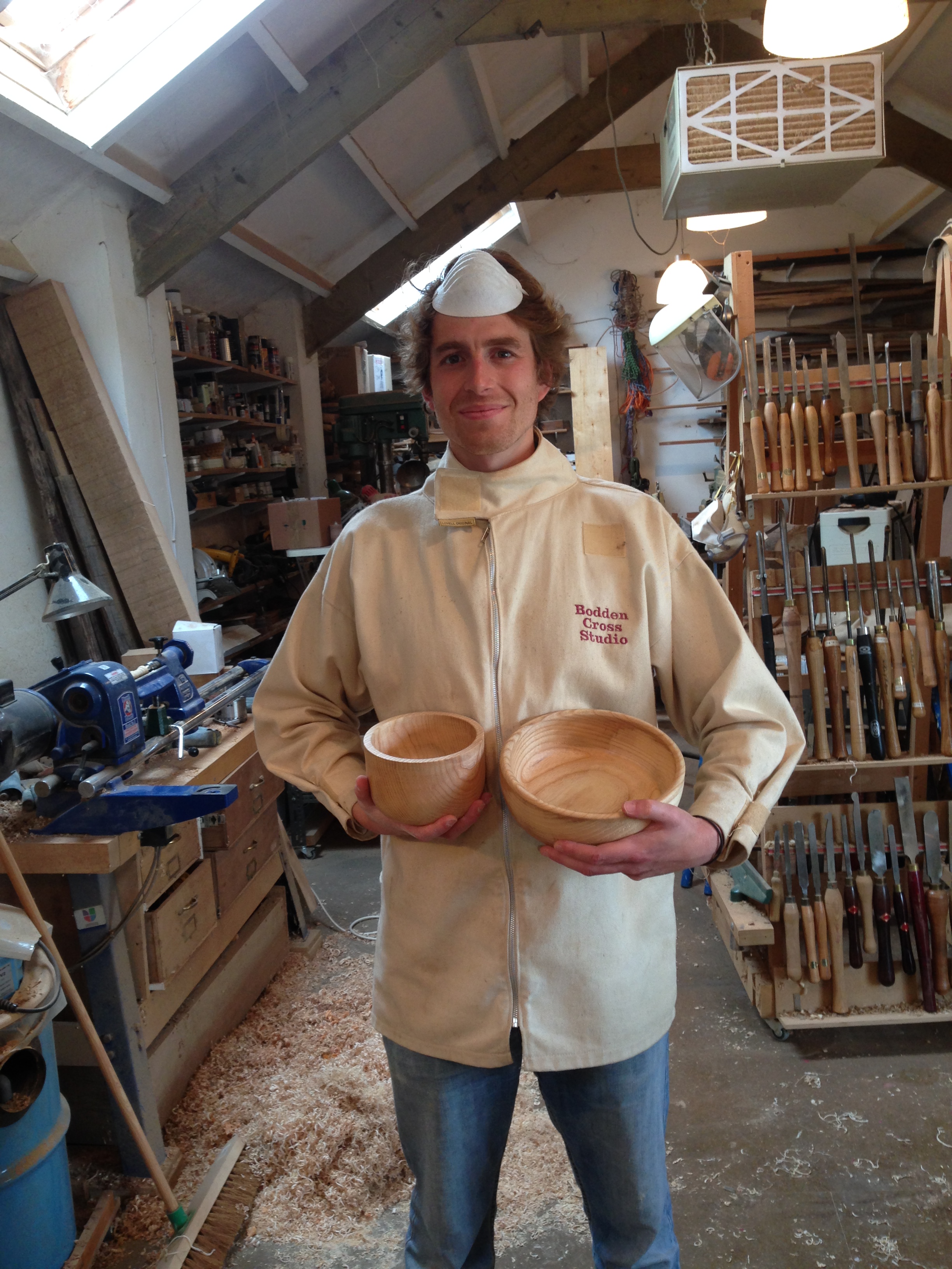 The dust mask is of course worn over the mouth when sanding - but doubles as a hat when posing for the portrait.