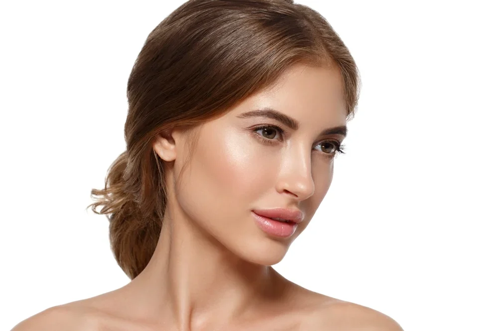 A beautiful brown haired woman looks to the right.