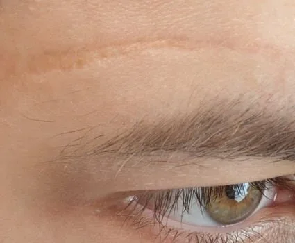 Close up of a man's green eye.