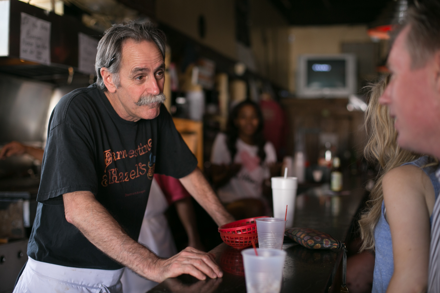 Clarence takes a break from running the grill at Earnestine & Hazel's to talk with some regulars. He gave me a tour of the upstairs, which used to be a brothel.