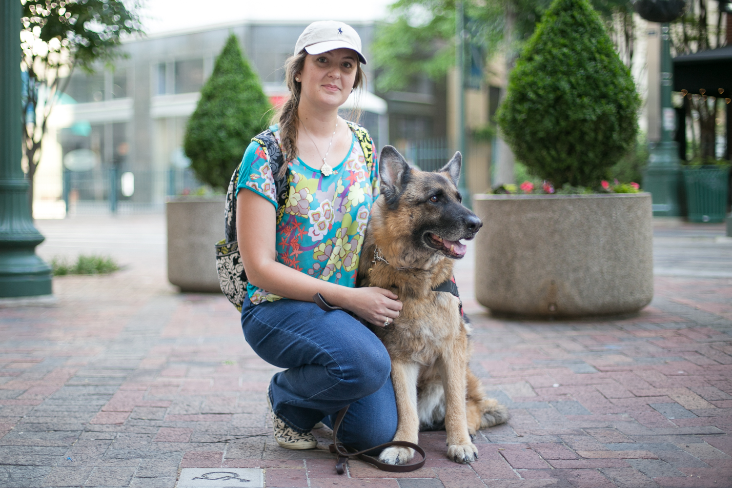   Ashley and Casch take a walk down south Main Street. Casch, a nine year old service dog, might be in retirement but he still sports his vest to get that special treatment he deserves.   