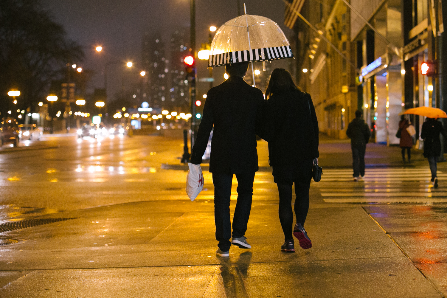  Update: halfway though and the rain is really coming down. Hun Ho and his girlfriend, Samantha share an umbrella on their way back to the dorms. 12/24 