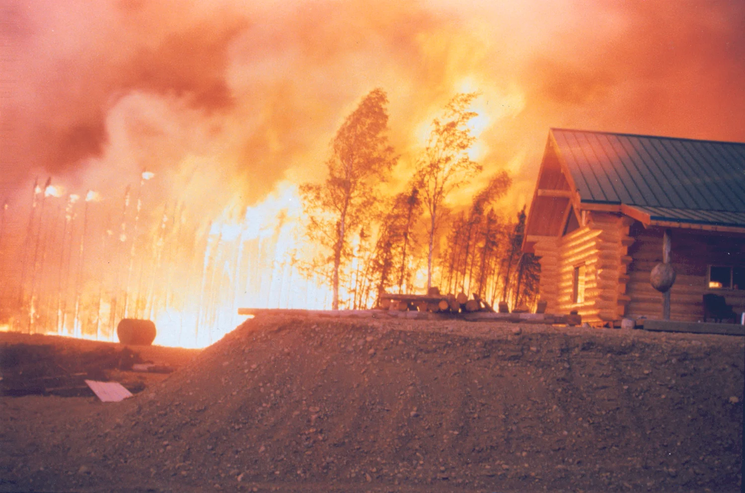  A home in the glow of the Miller’s Reach Fire. Photo courtesy of the Matanuska Susitna Borough Emergency Services. 