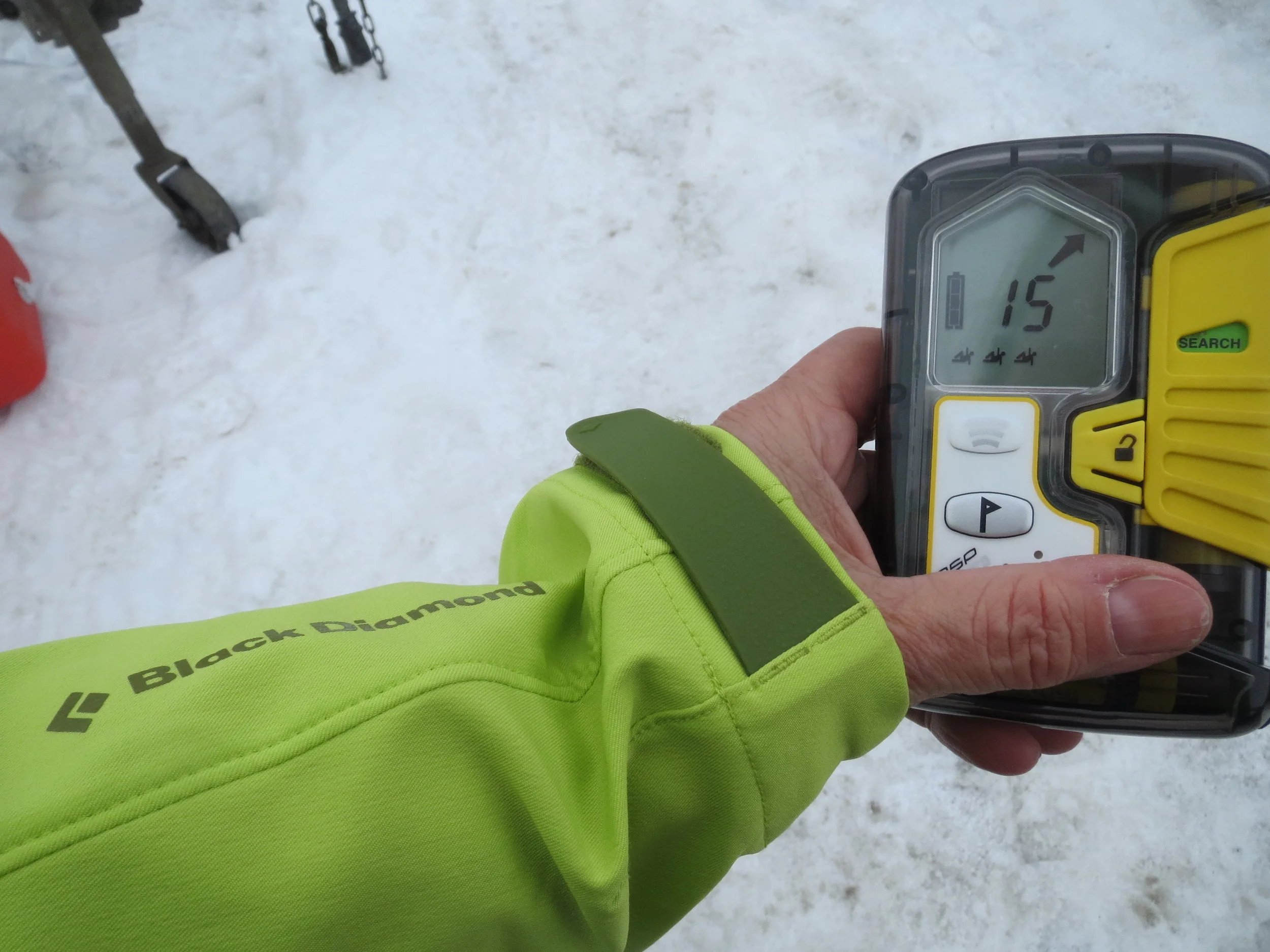  Using an avalanche transceiver to search for a buried victim.&nbsp; 