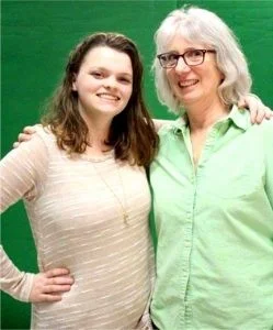  Alyssa with her teacher, Sally Hoople. 