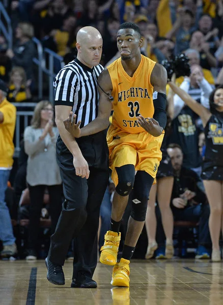 Bald ref sneers at McDuffie after he cashes a trey at "The Roundhouse"