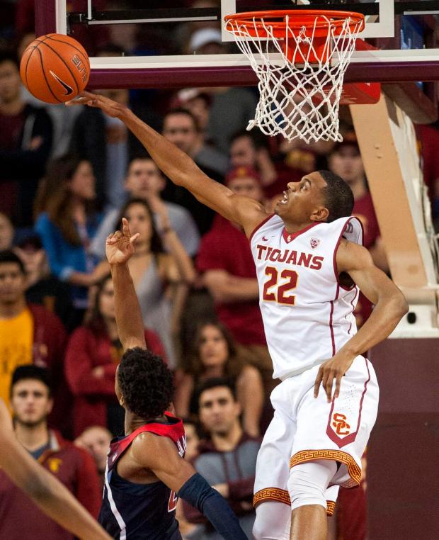 De'Anthony Melton skies to send away a reverse layup by Arizona's Kobi Simmons
