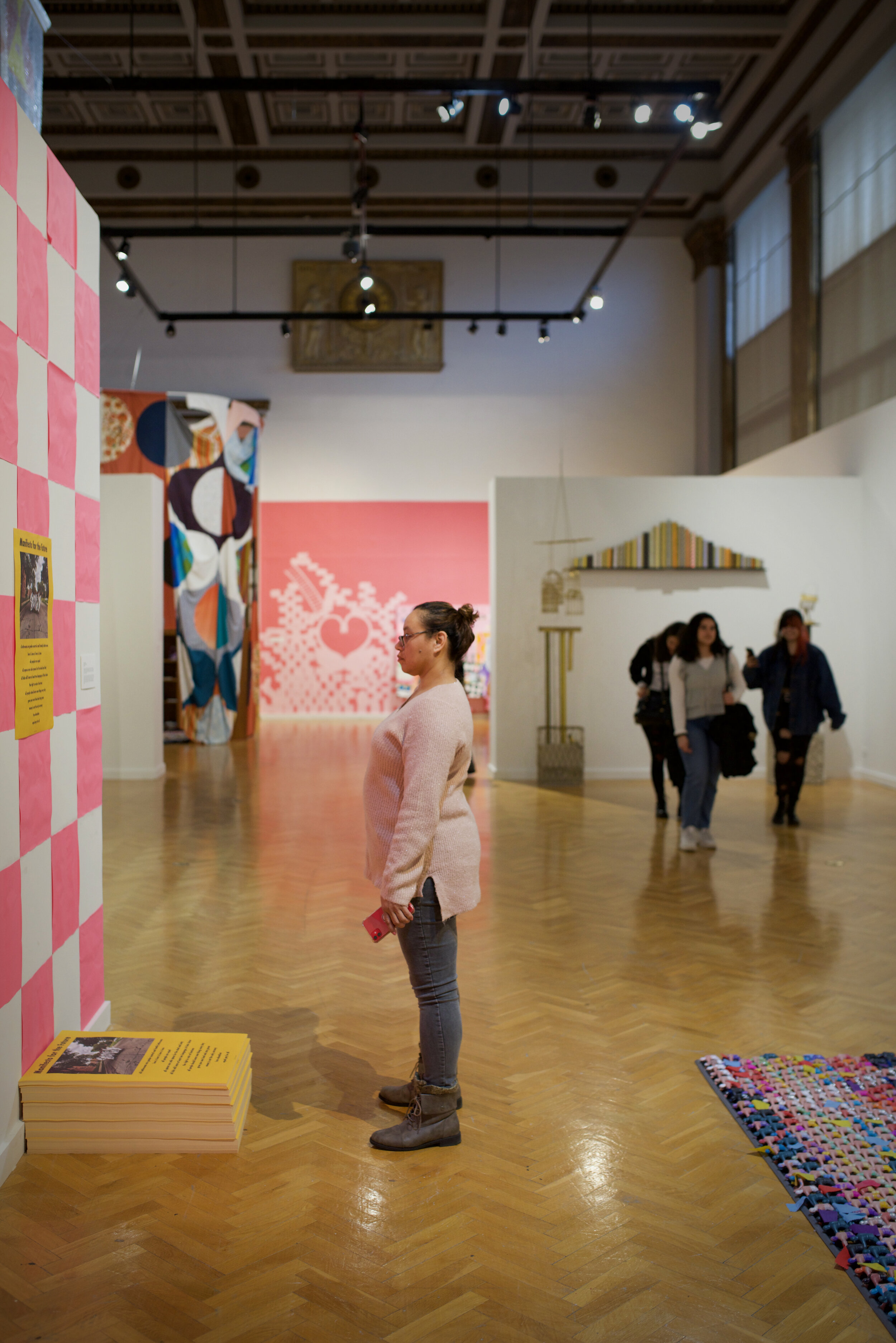   In Flux  visitors viewing exhibition – photo by Gloria Arroyo. 