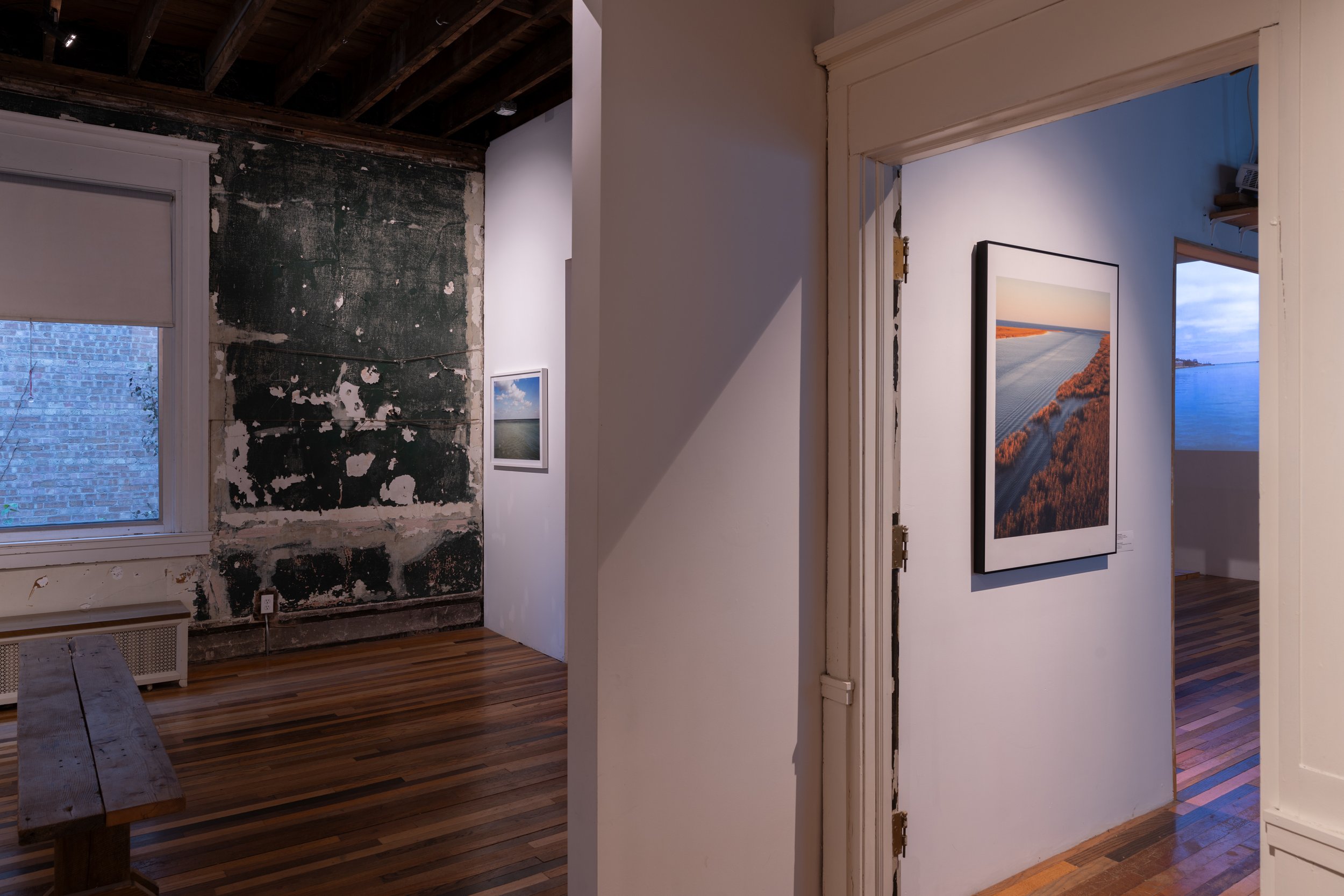  Foreground: Virginia Hanusik –  The End of the Mississippi River in Port Eads, Louisiana , 2020; background: Jin Lee – from the  Great Water  series; and Jennifer Buyck –  Chicago par ses rivières / Chicago by its rivers , 2023 – photography by Nath