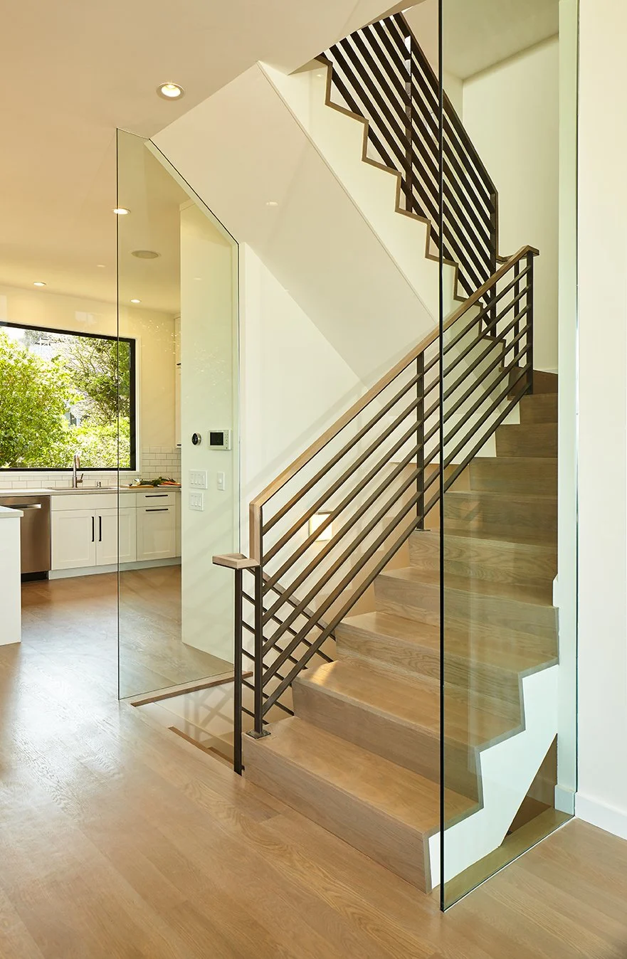 Stairwell remodeled by Hive Builds general contractor