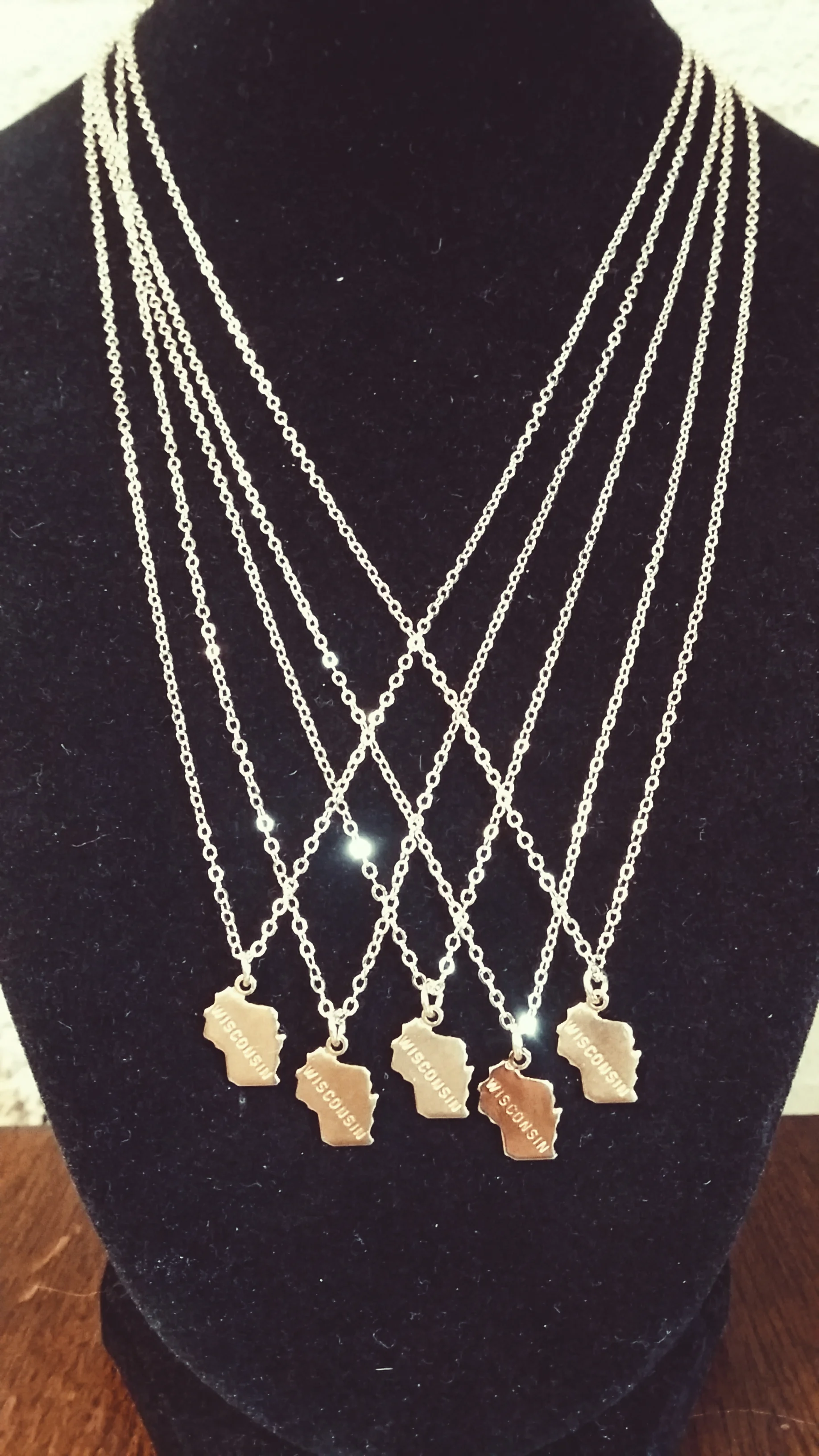 Native or not, keep a little piece of Wisconsin close to her heart. Delicate and gold-plated and $18 each.