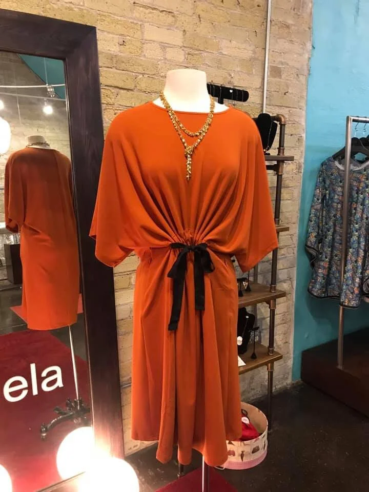 Orange Samual Dong dress. Available in store.