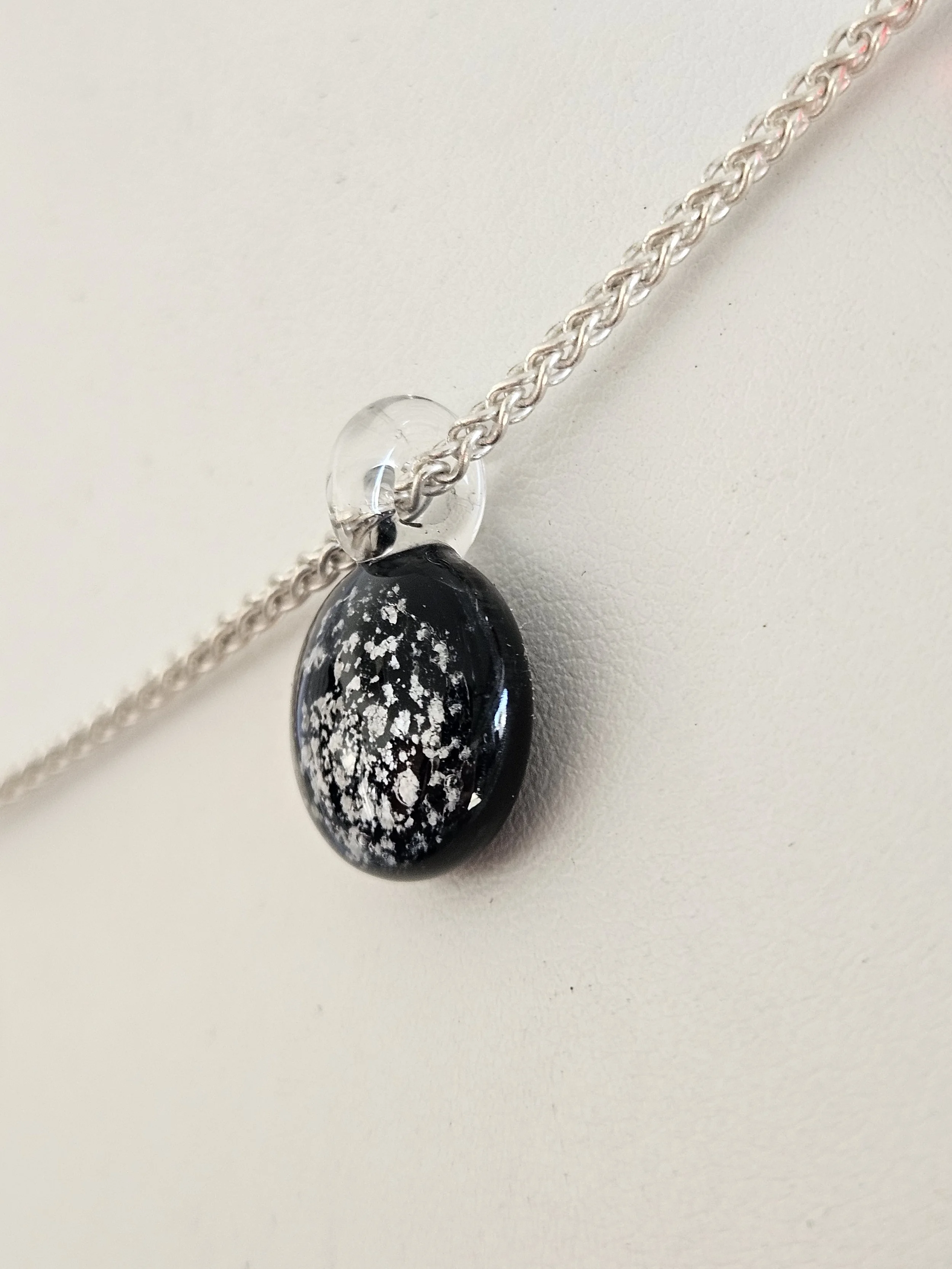 black glass with ashes incorpoerated handmade glass jewelry.jpg
