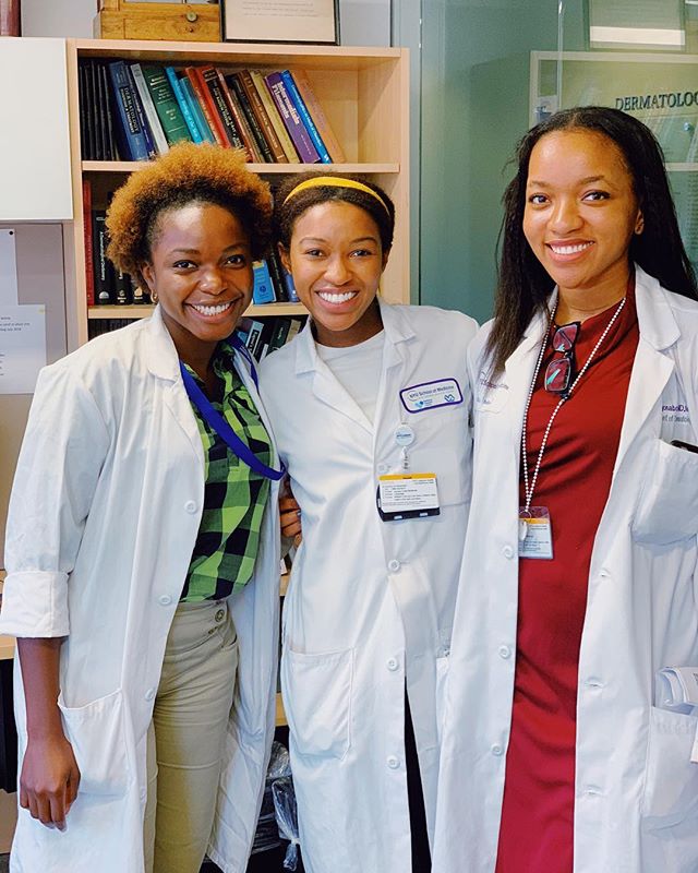 Friday morning clinic with my doppelgängers 👩🏾⚕️👩🏾⚕️👩🏾⚕️ 😹 | I don’t normally post photos of me in a white coat. Medicine is like my baby that I hold close to my chest, but today I feel inspired to share with you what a privilege it is to have the knowledge and training to help others during the unfair and frightening times of life. I am so grateful I get to do this everyday. 💙