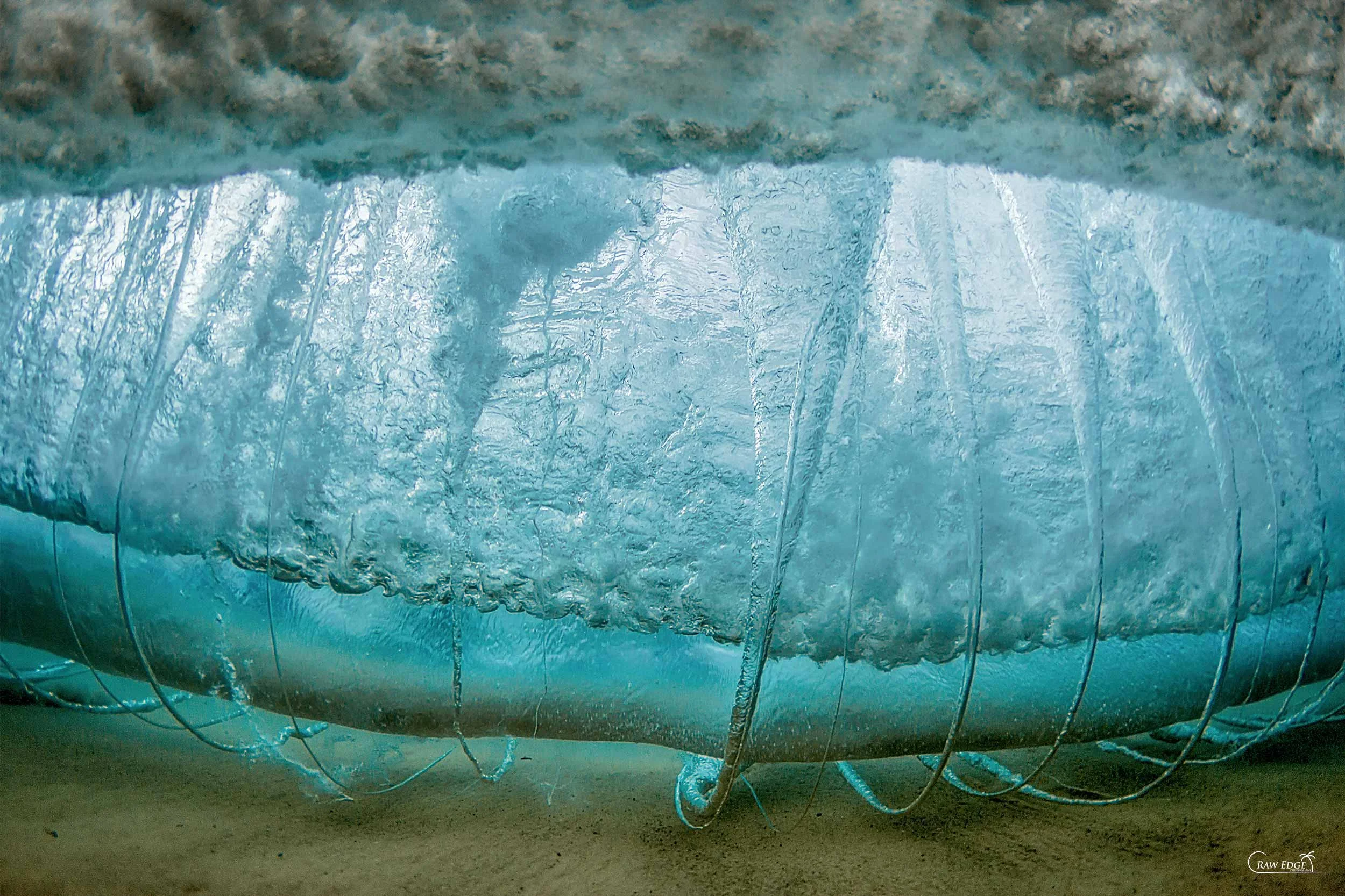 A powerful underwater wave vortex captured by Raw Edge Photography