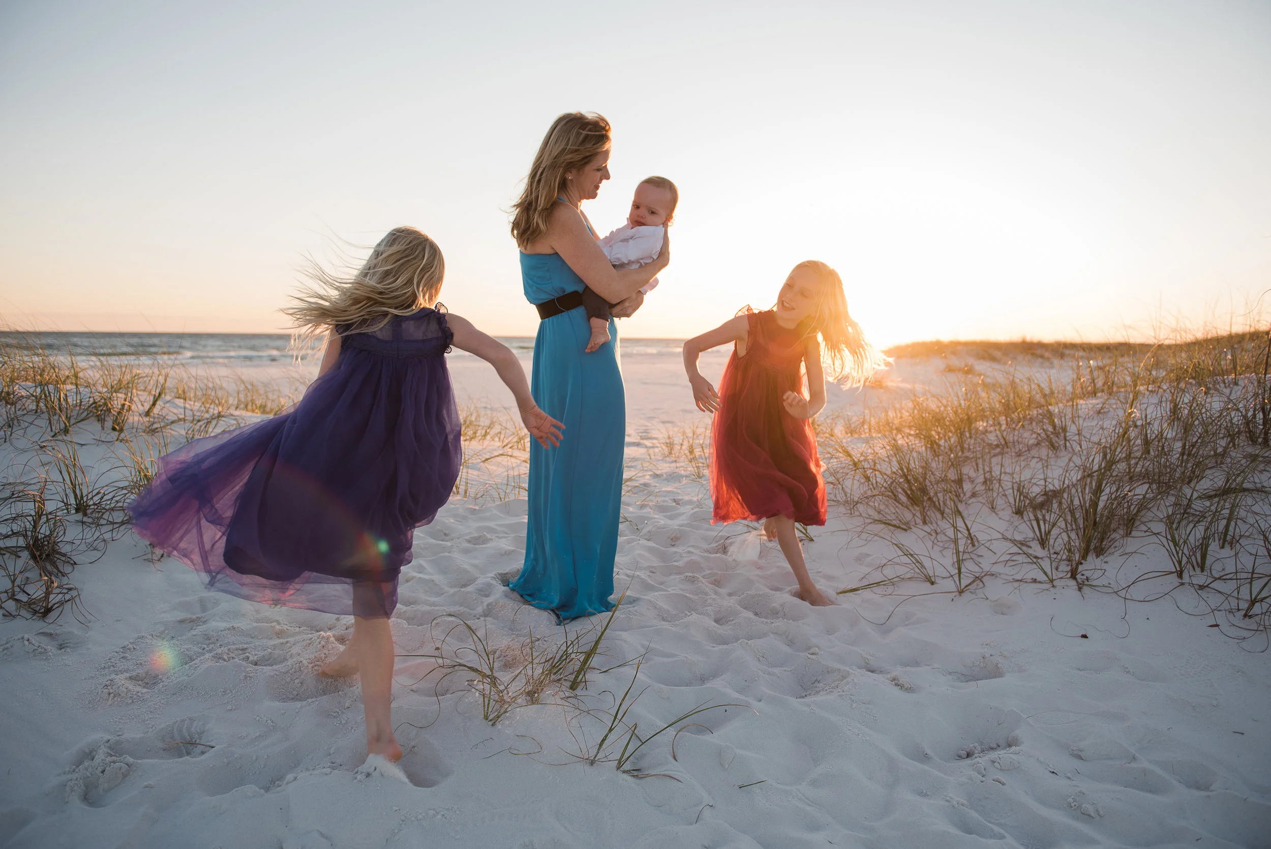 girls running around mom-pensacola beach family photographer