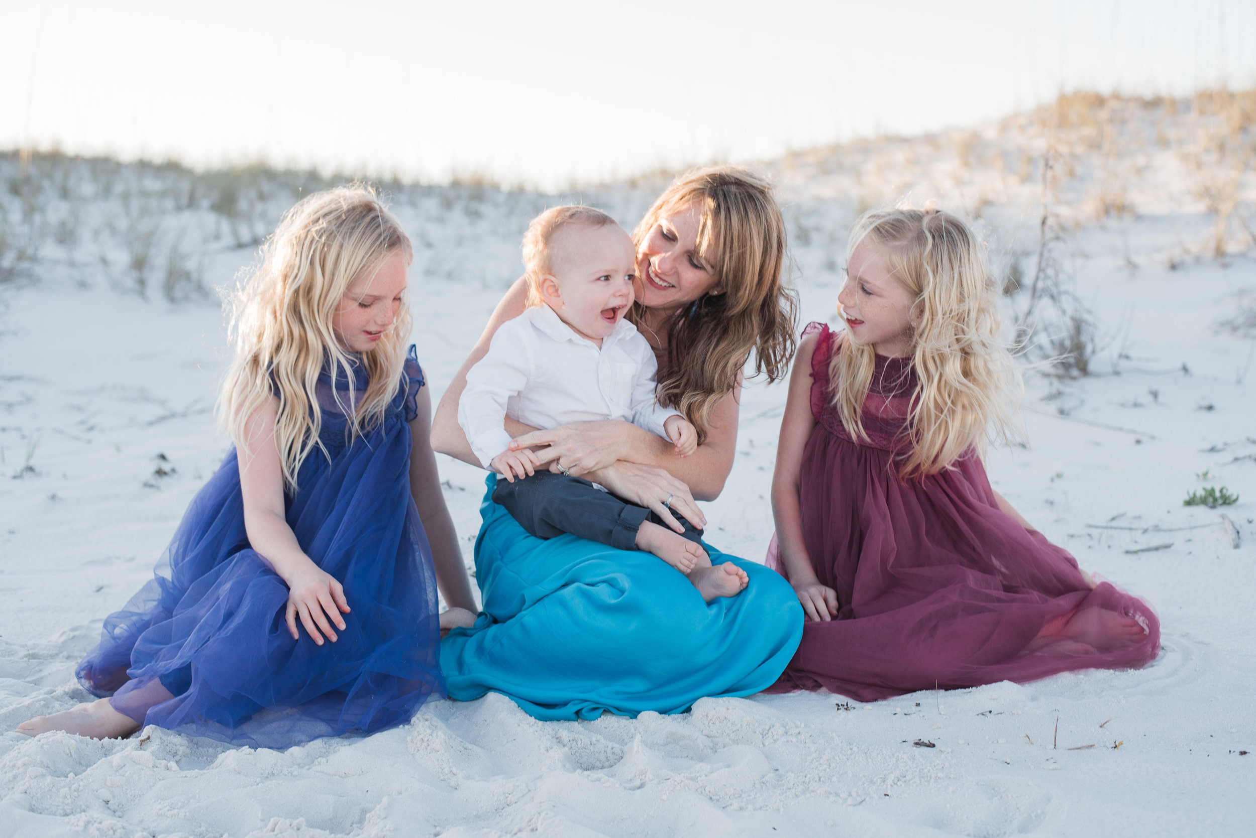girls looking at baby-Pensacola beach family photographer
