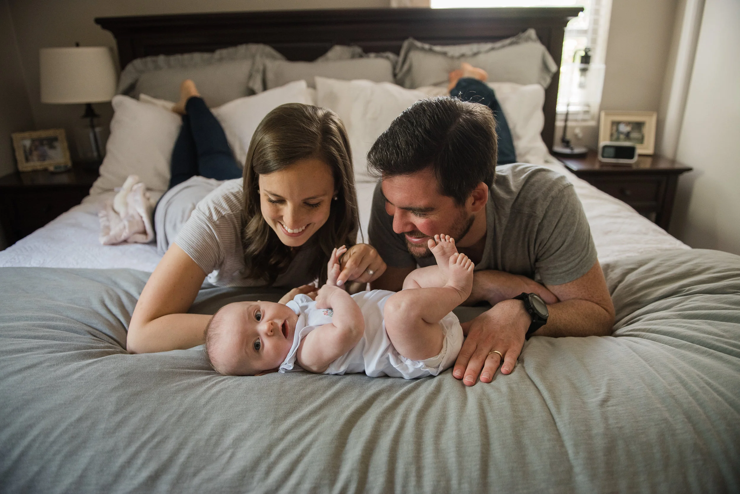 mom and dad watching baby-pensacola child Photographer