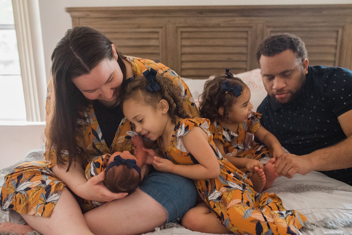 Family on bed- Pensacola Newborn Photographer-Ann Mangum  Photographer