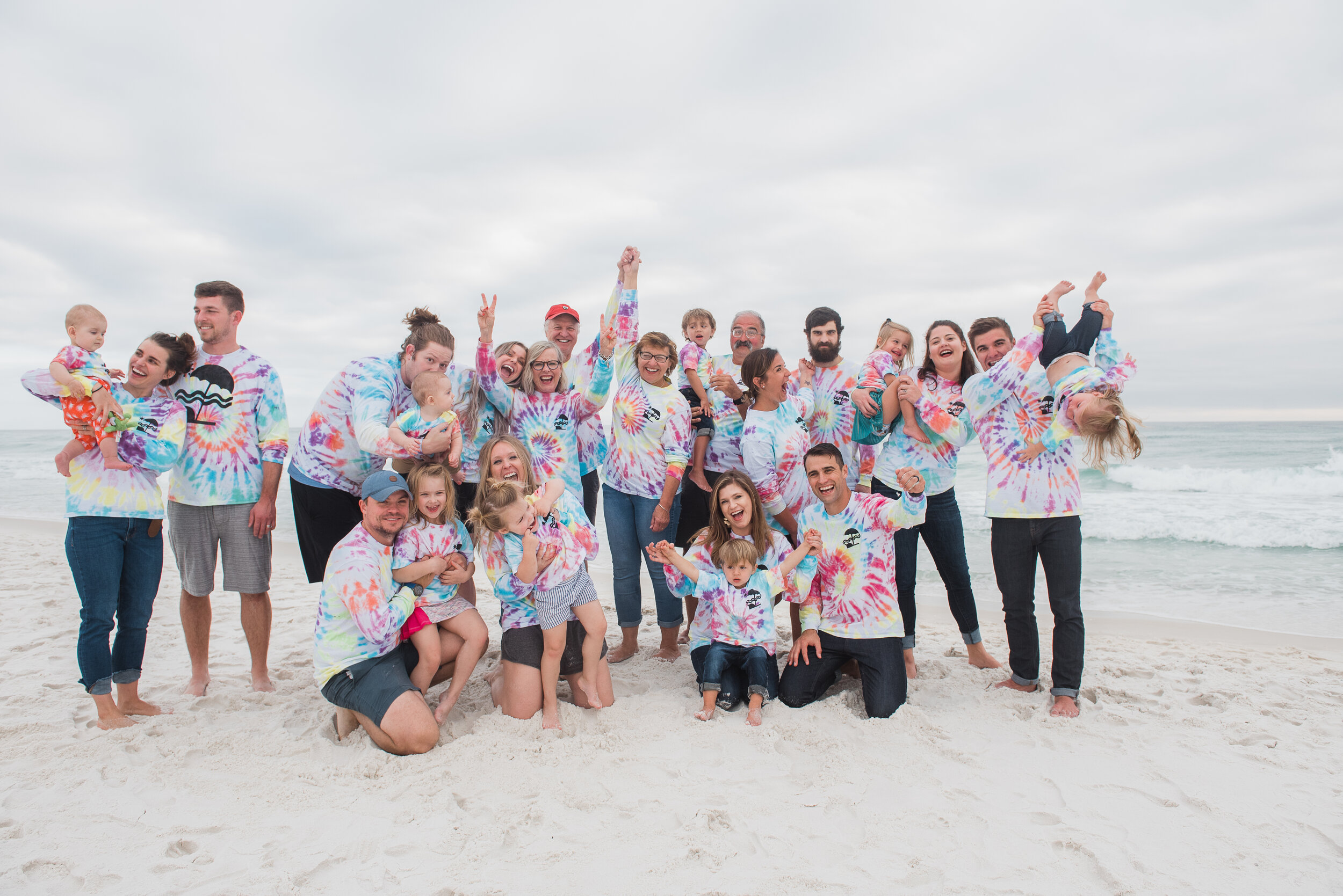 extended family on cloudy day at beach-pensacola family photographer-Ann Mangum Photography