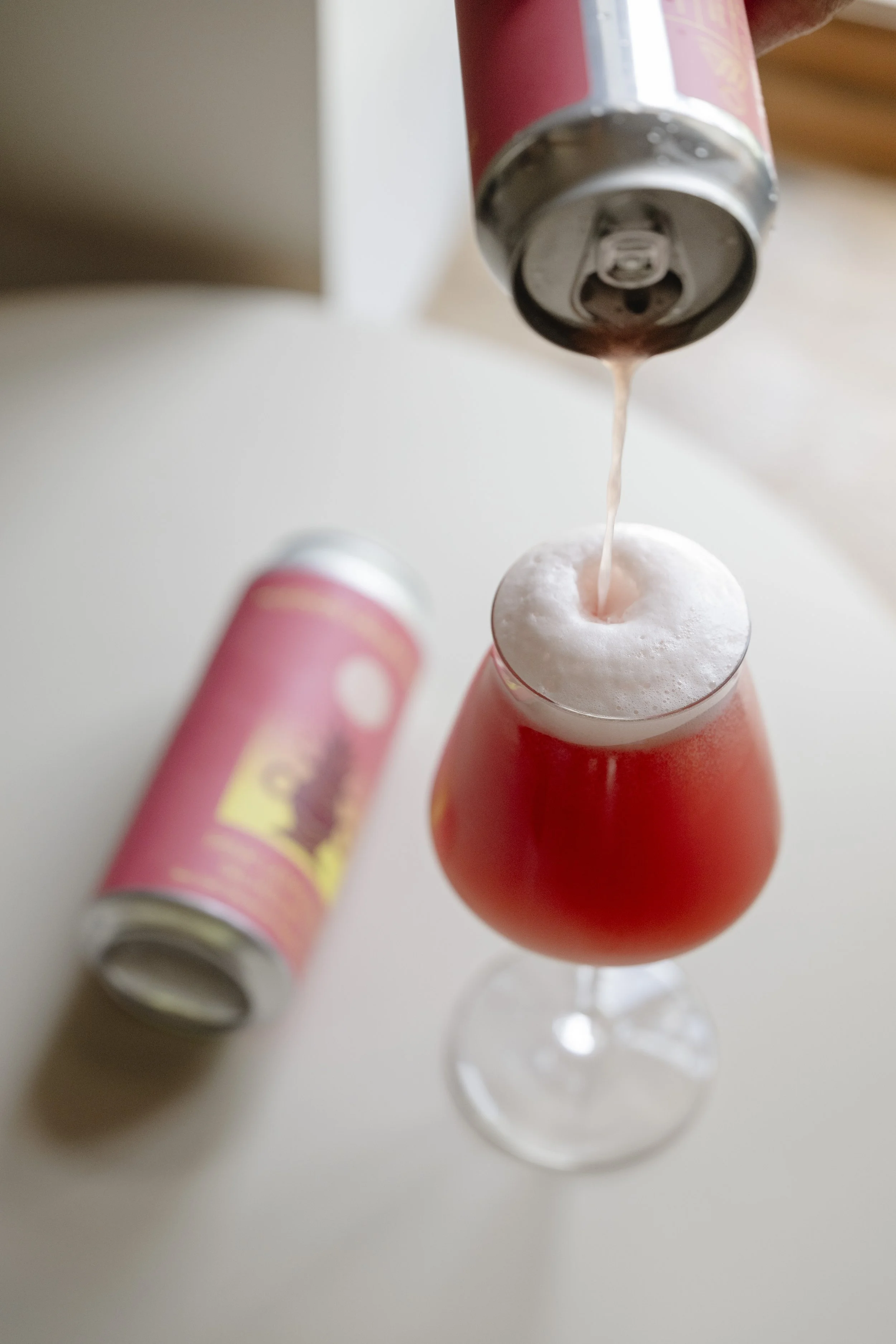 Pink Lemonade being poured into a glass