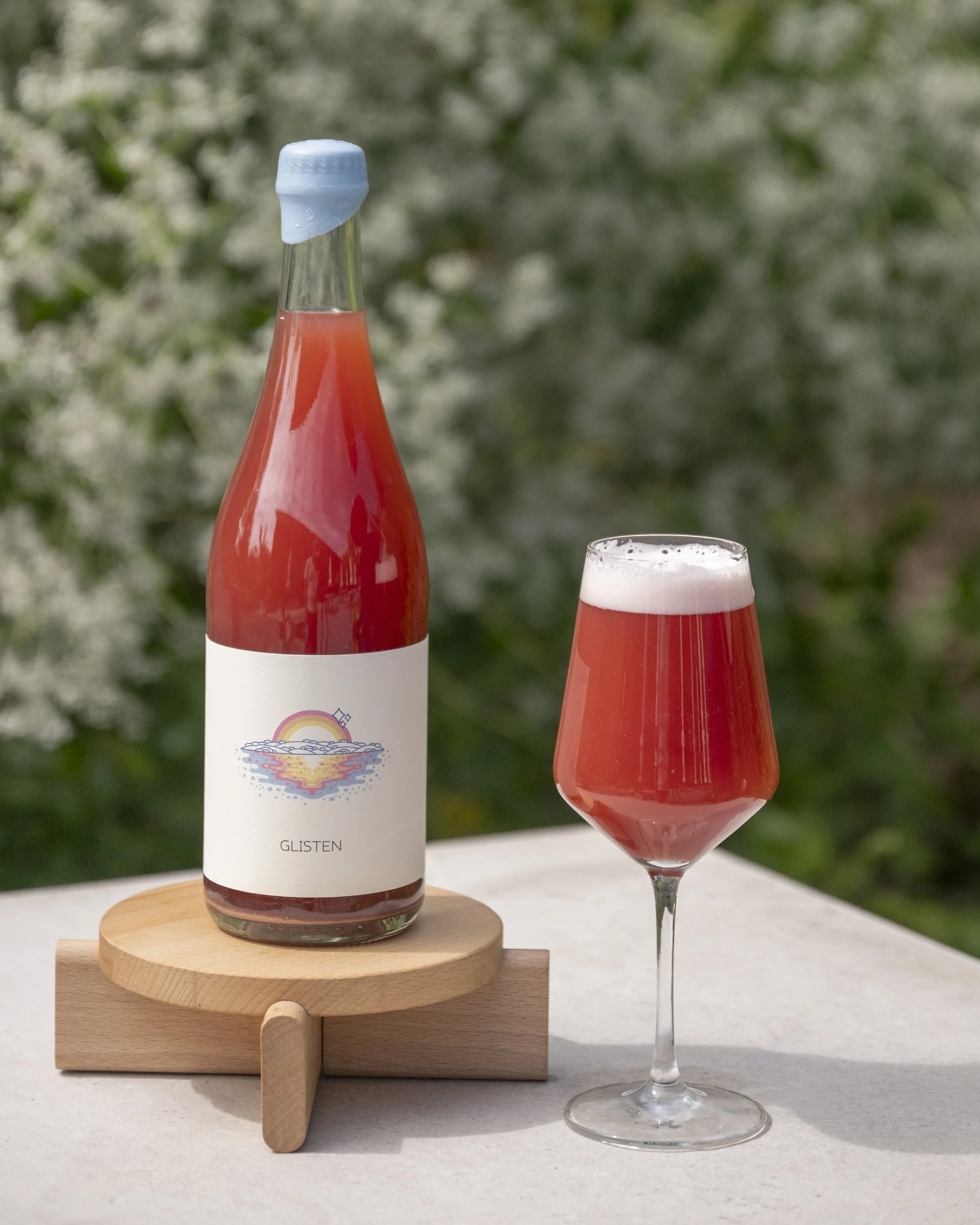 Photo of Glisten in a bottle and glass