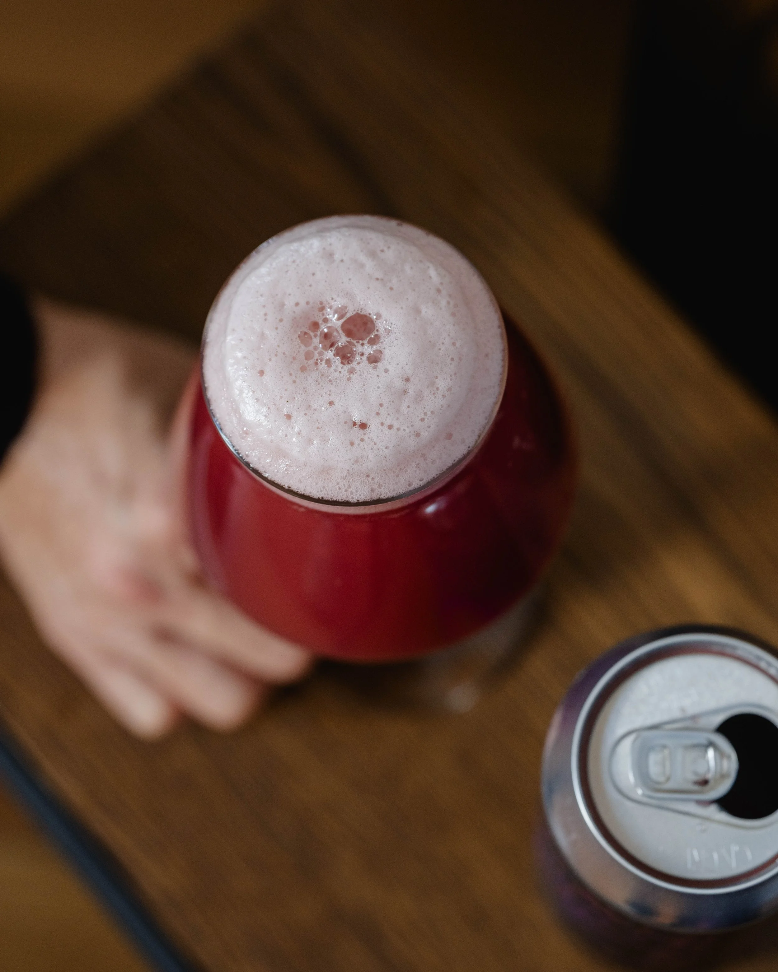A beautiful glass of Hellmouth, featuring red hues from the marionberry.