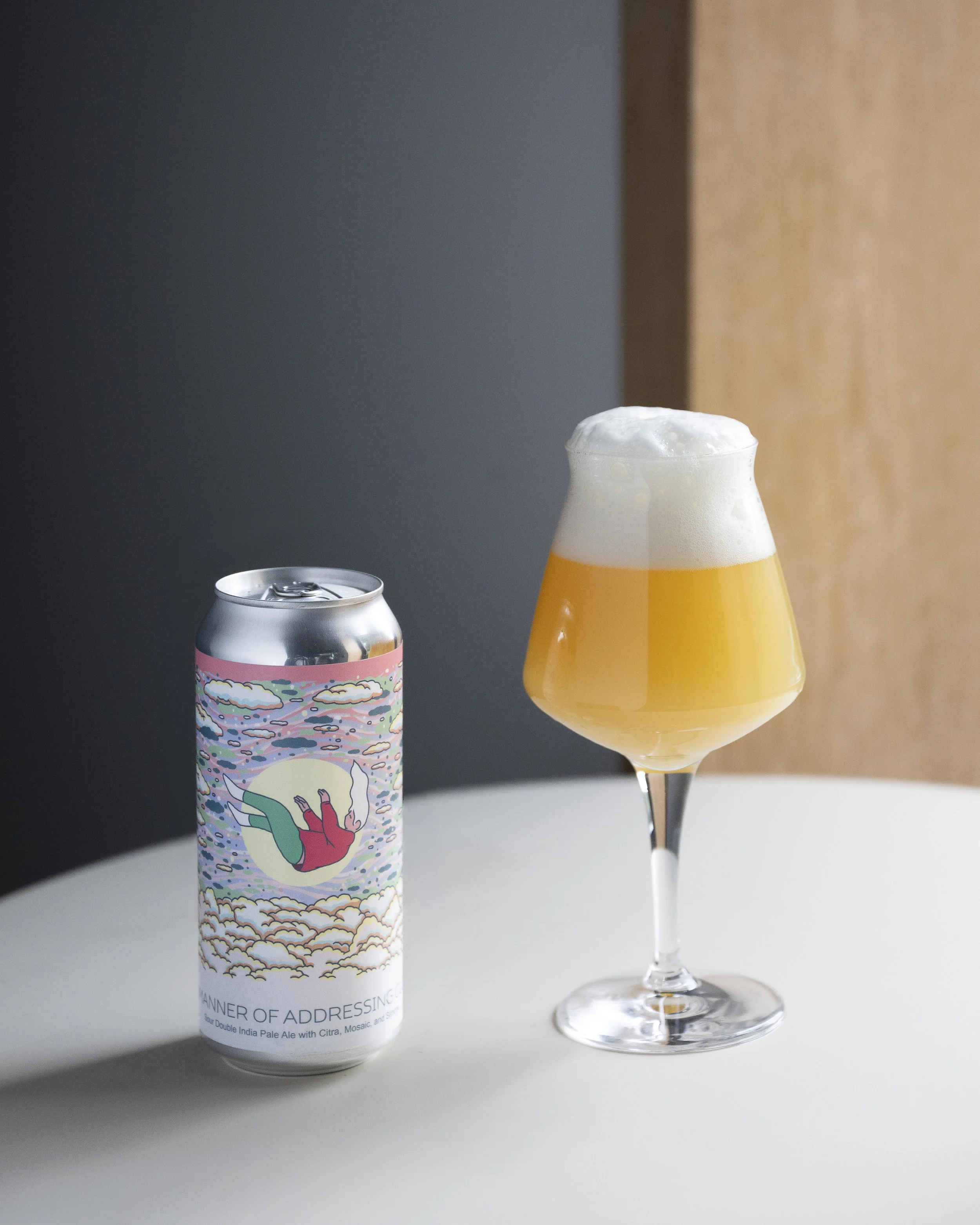 The Manner Of Addressing Clouds Sour IPA in can and glass