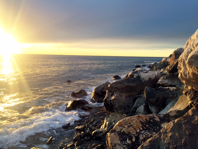 Catch the sun set by the water