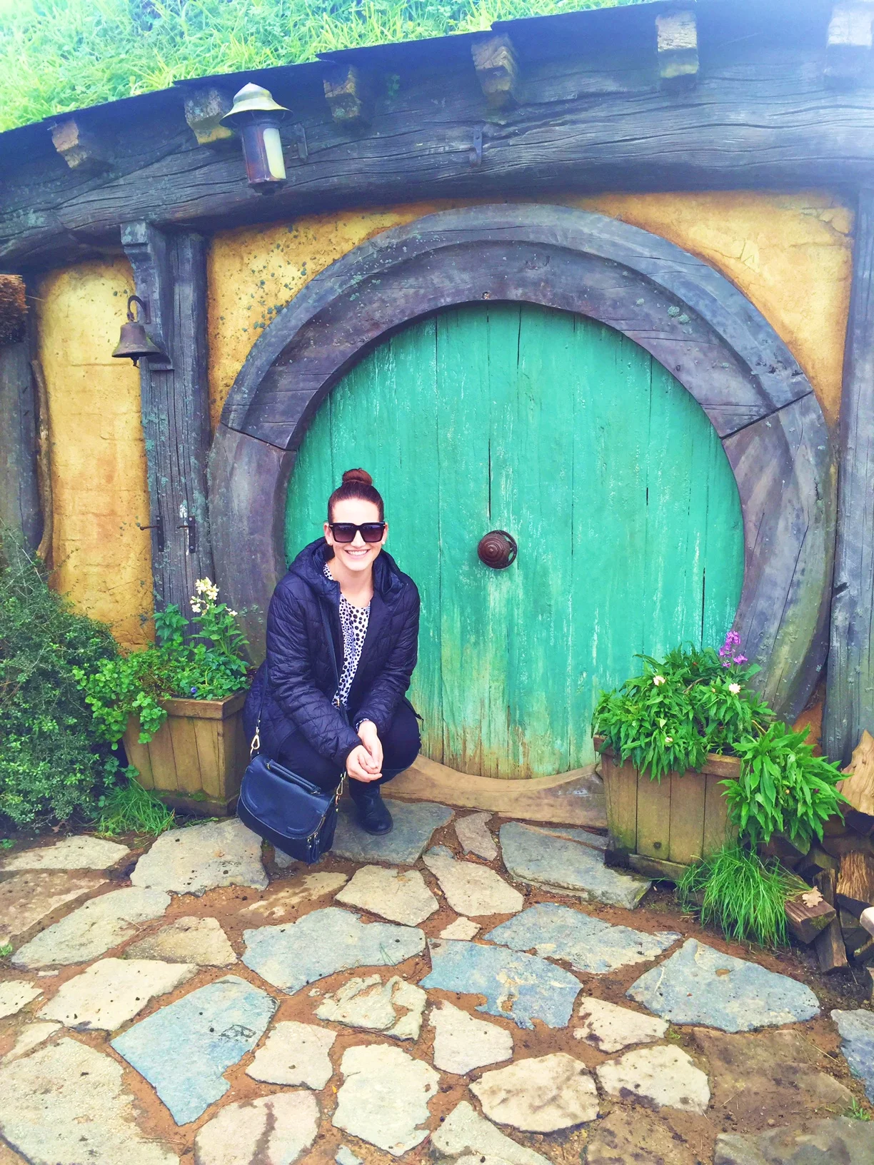 Here I am squatting next to a little door