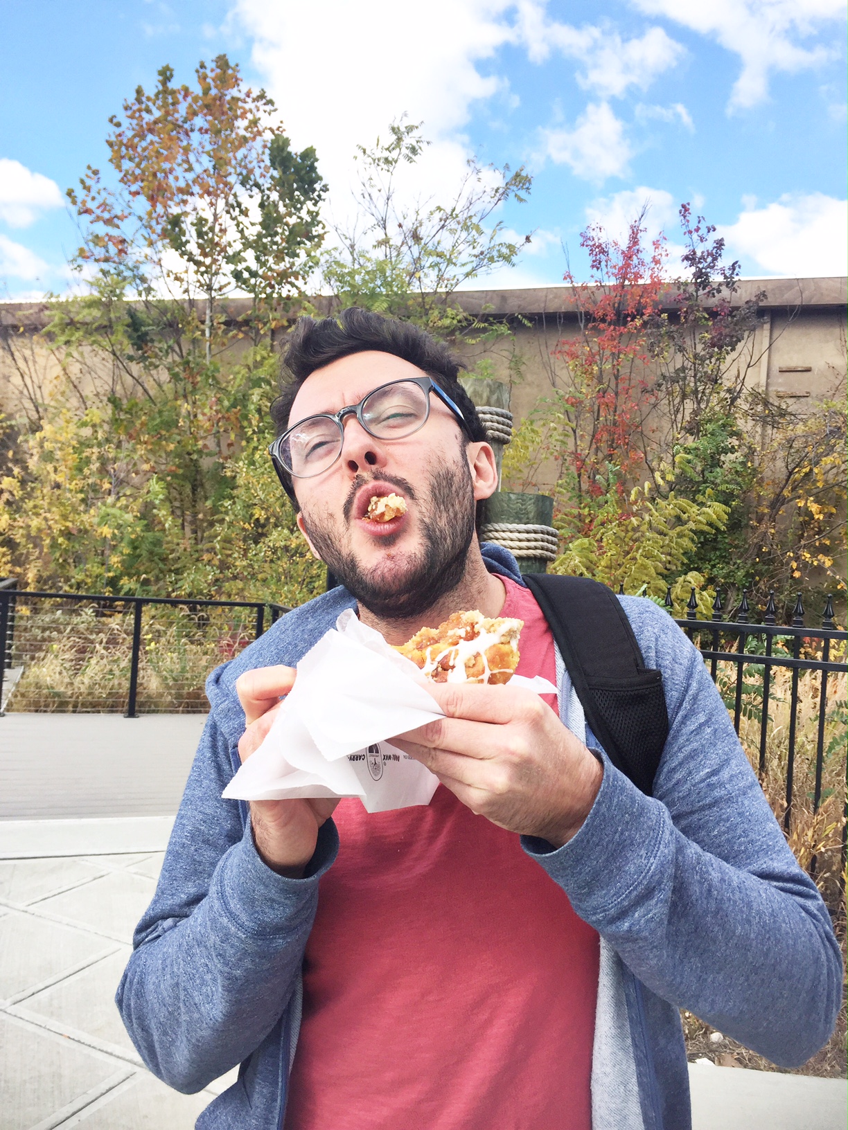The face of a happy man and his danish