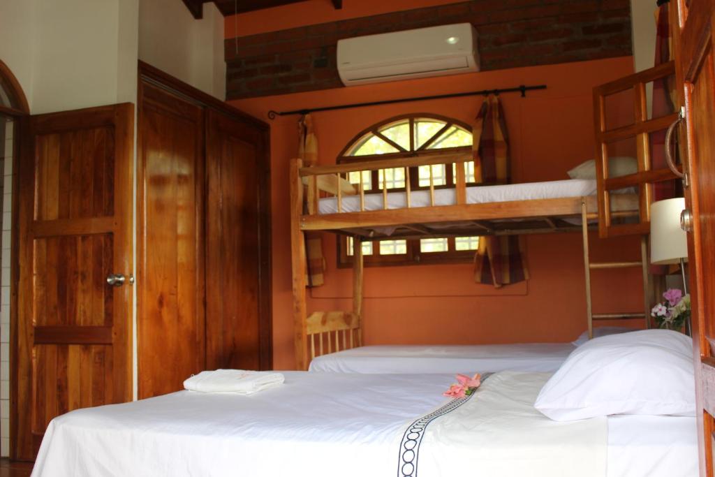 coconut-surf-camp-nicaragua-villa-suite-beds.jpg