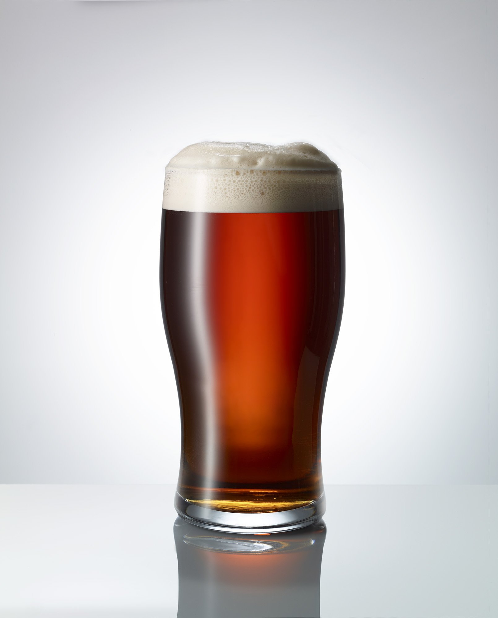 Pint of beer on a white background