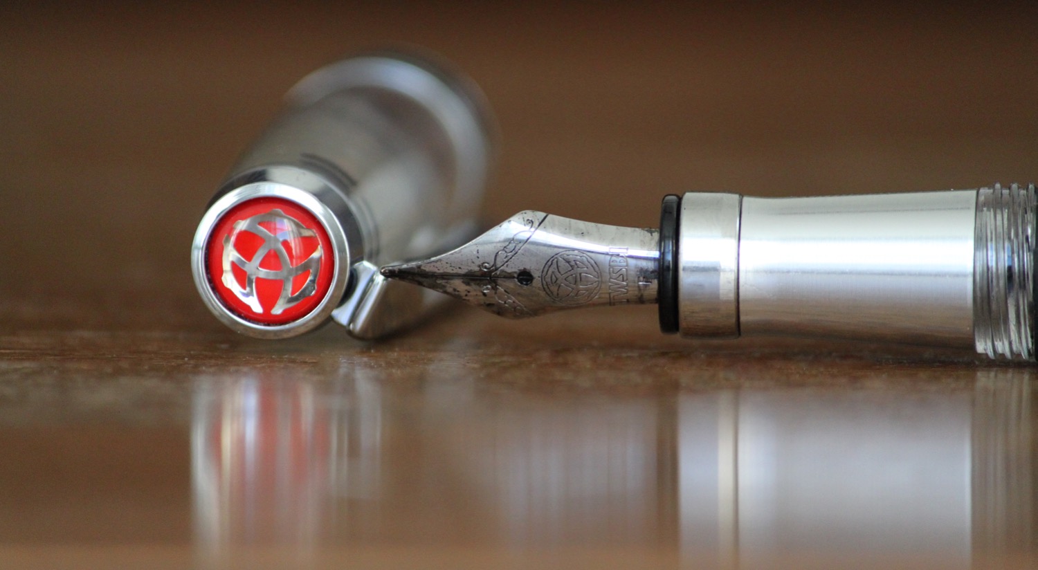 Noodler's Bulletproof is known for nib creep, but it compliments the beautiful etchings on the TWSBI nib.