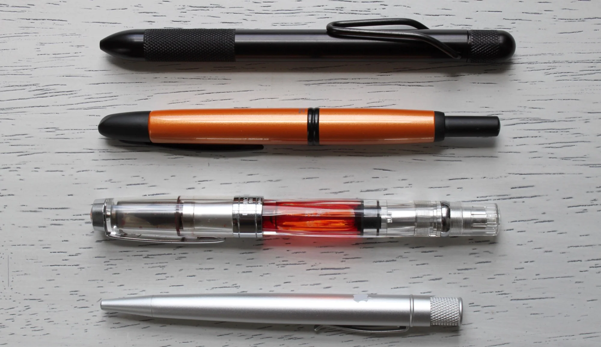From top to bottom: RIIND Pen, Pilot Vanishing Point, TWSBI Diamond 580AL, Retro 51 Tornado Slim