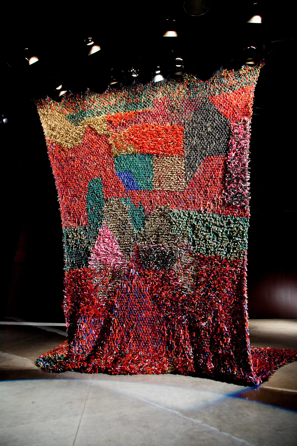 Shotgun Shell Tapestry 2015, Used shotgun shells, wire rope, plastic, 25 x 19 feet